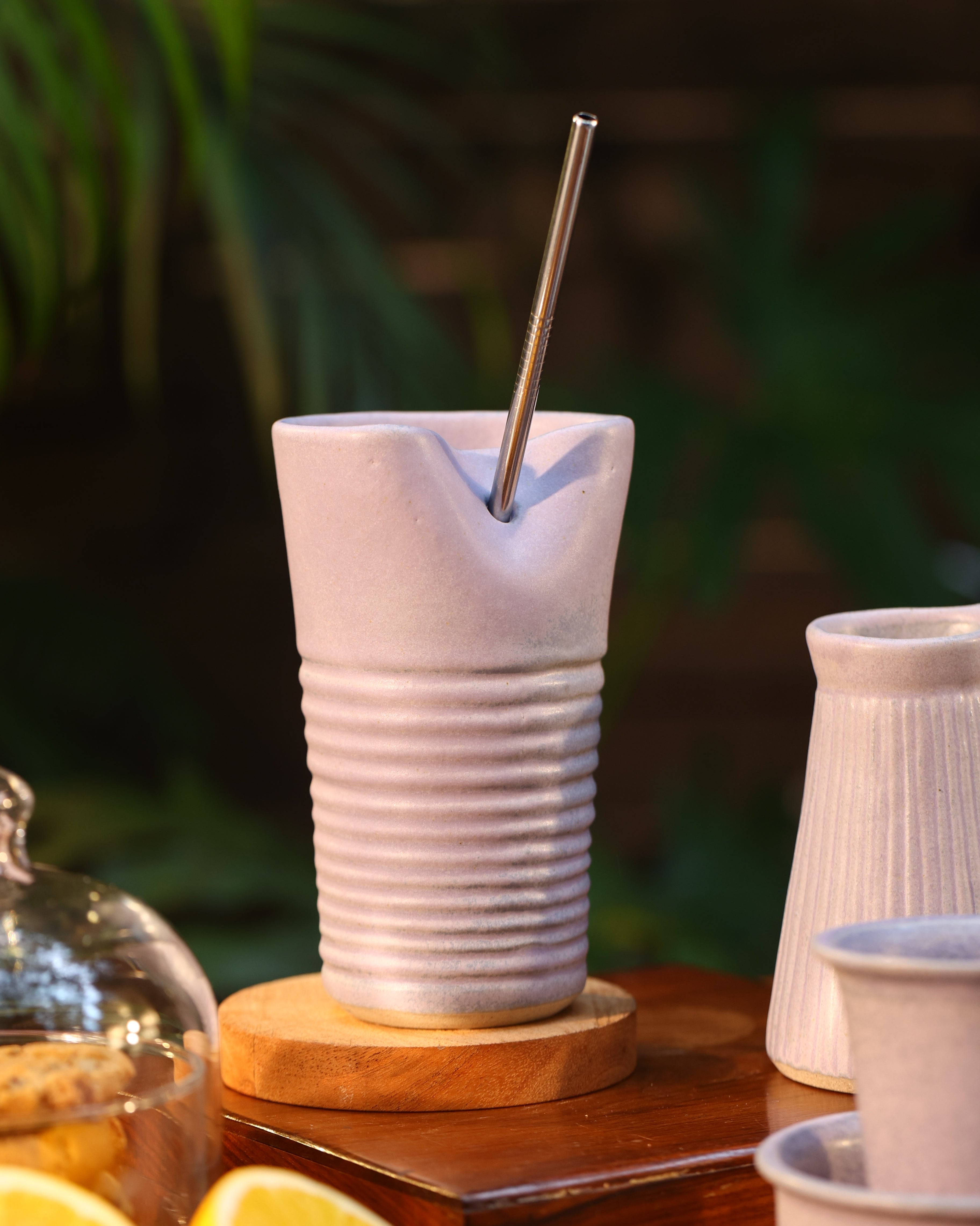 A pink tumbler with a metal straw, ceramic coffee mugs online,
Indian pottery brands online