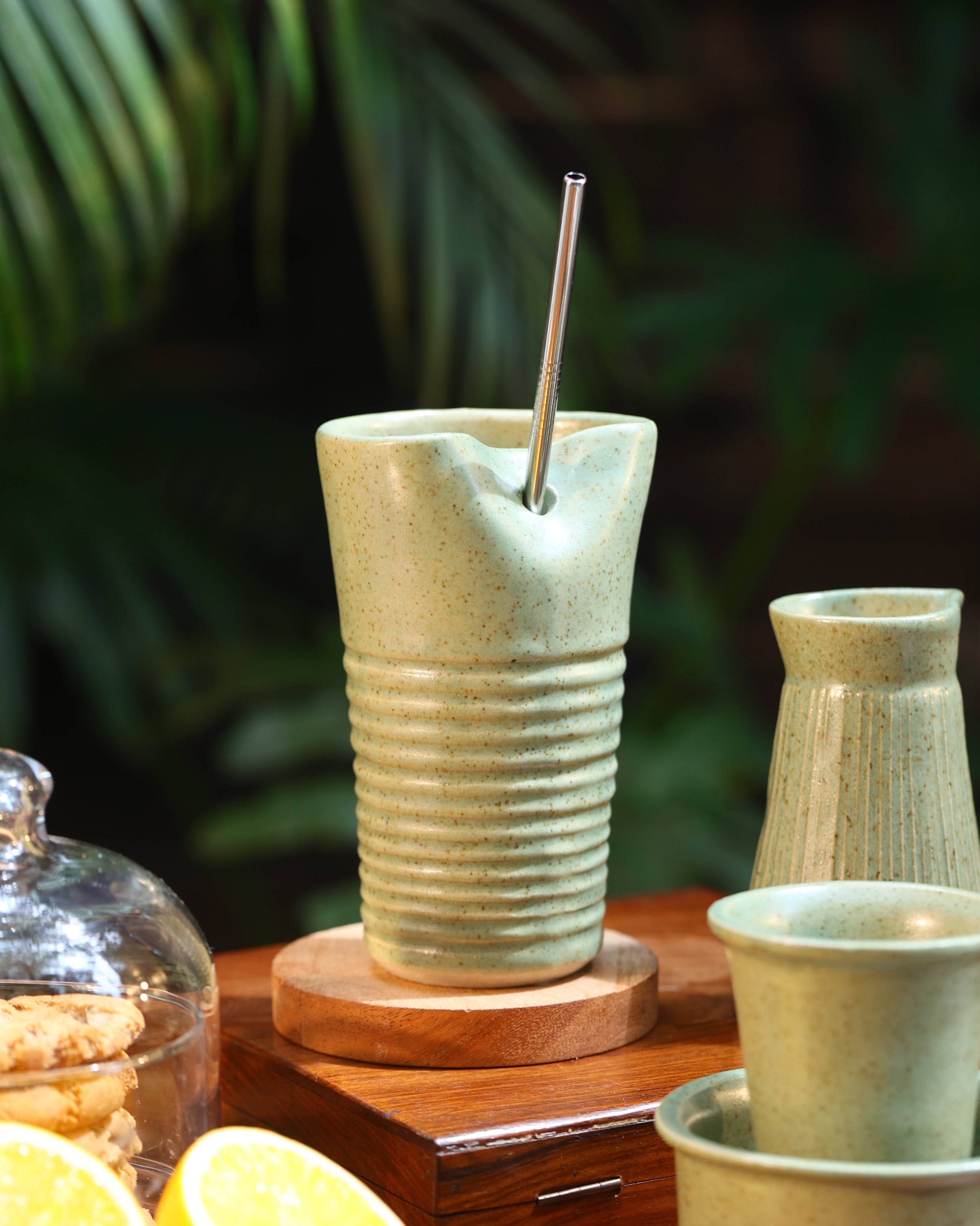 Green Tumbler with a metal straw, ceramic coffee mugs online, Indian pottery brands online