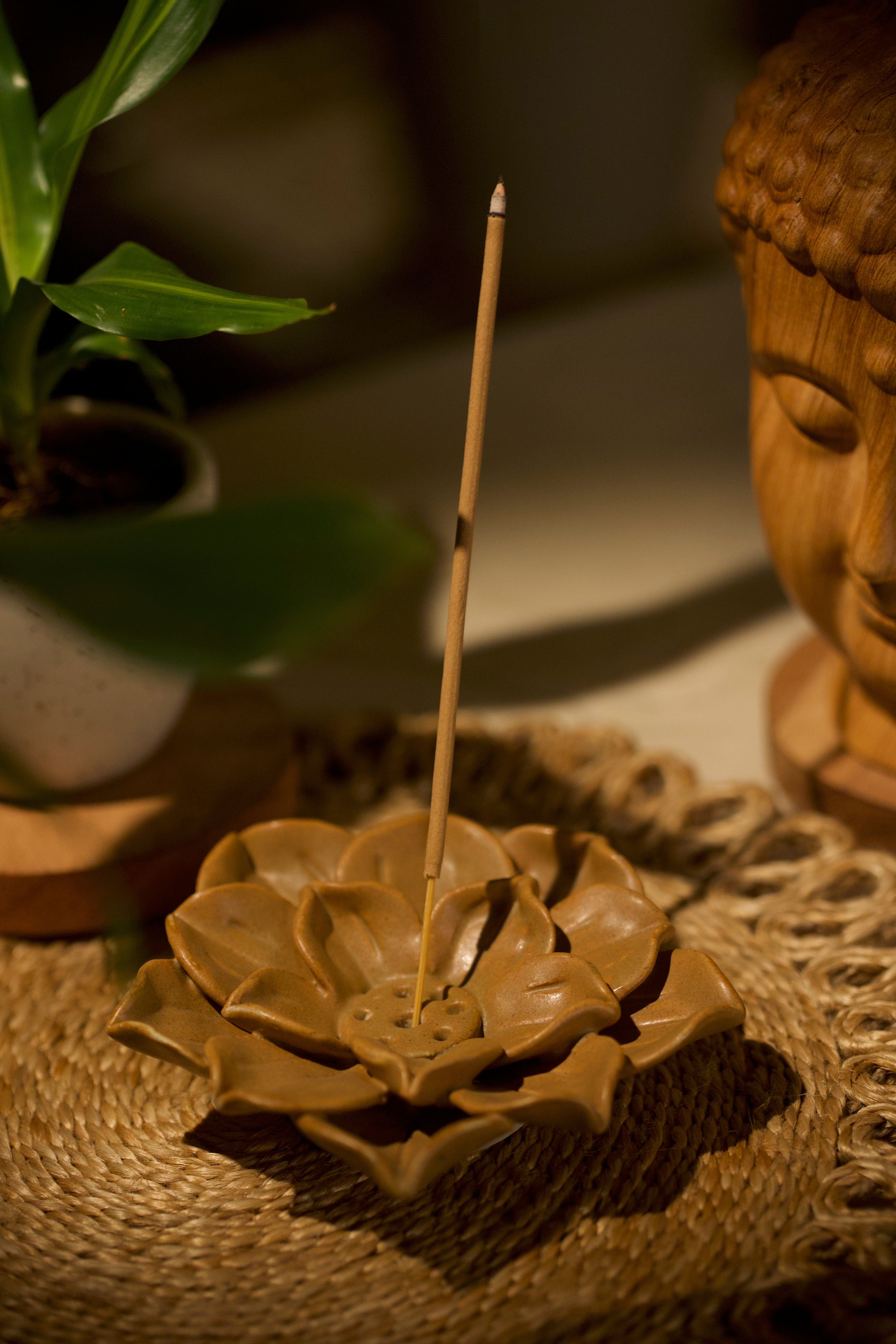 A mustard lotus incense holder. ceramic home décor online, artisanal home décor India