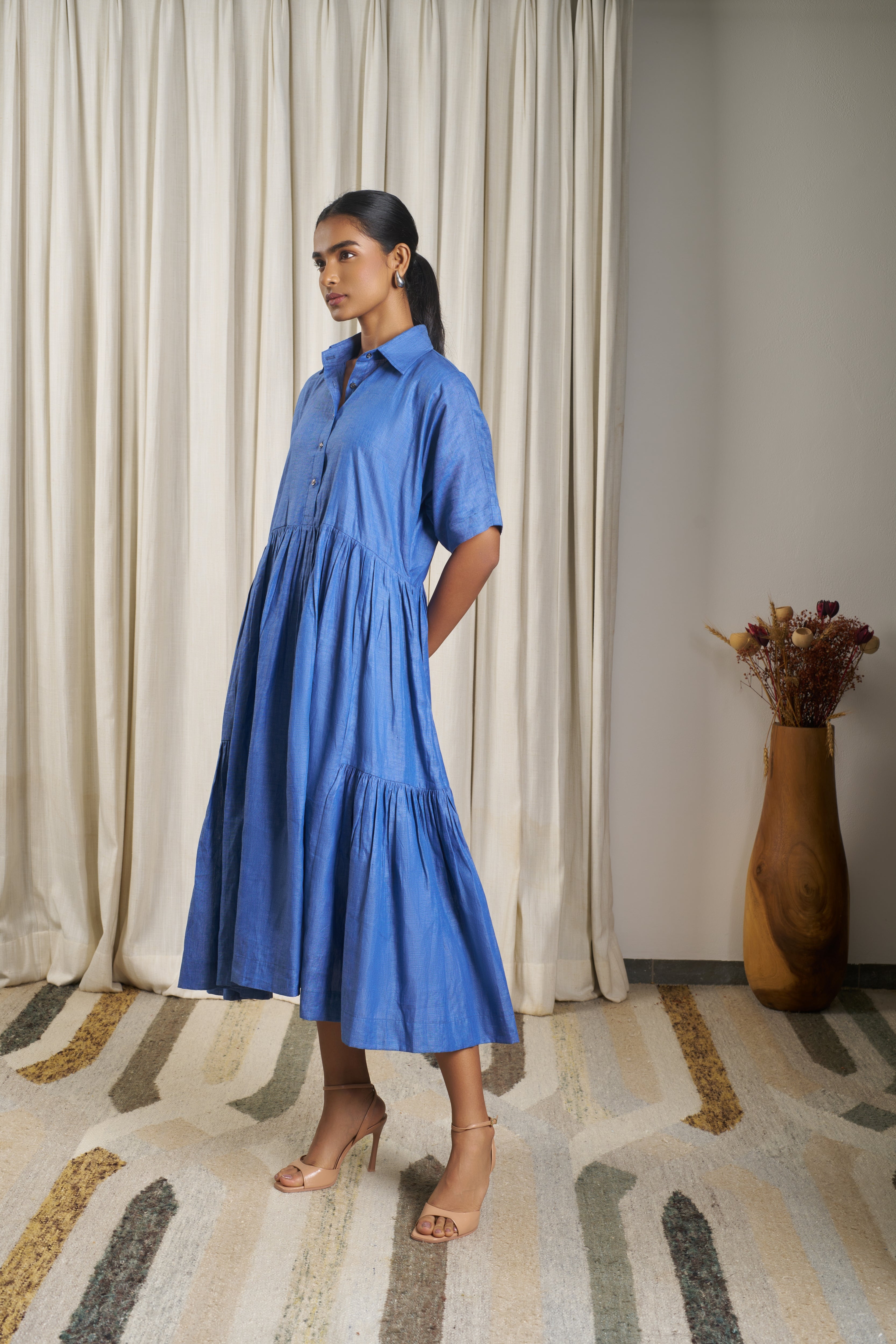 Woman wearing a blue dress. linen dresses for women India, minimalist clothing brands India