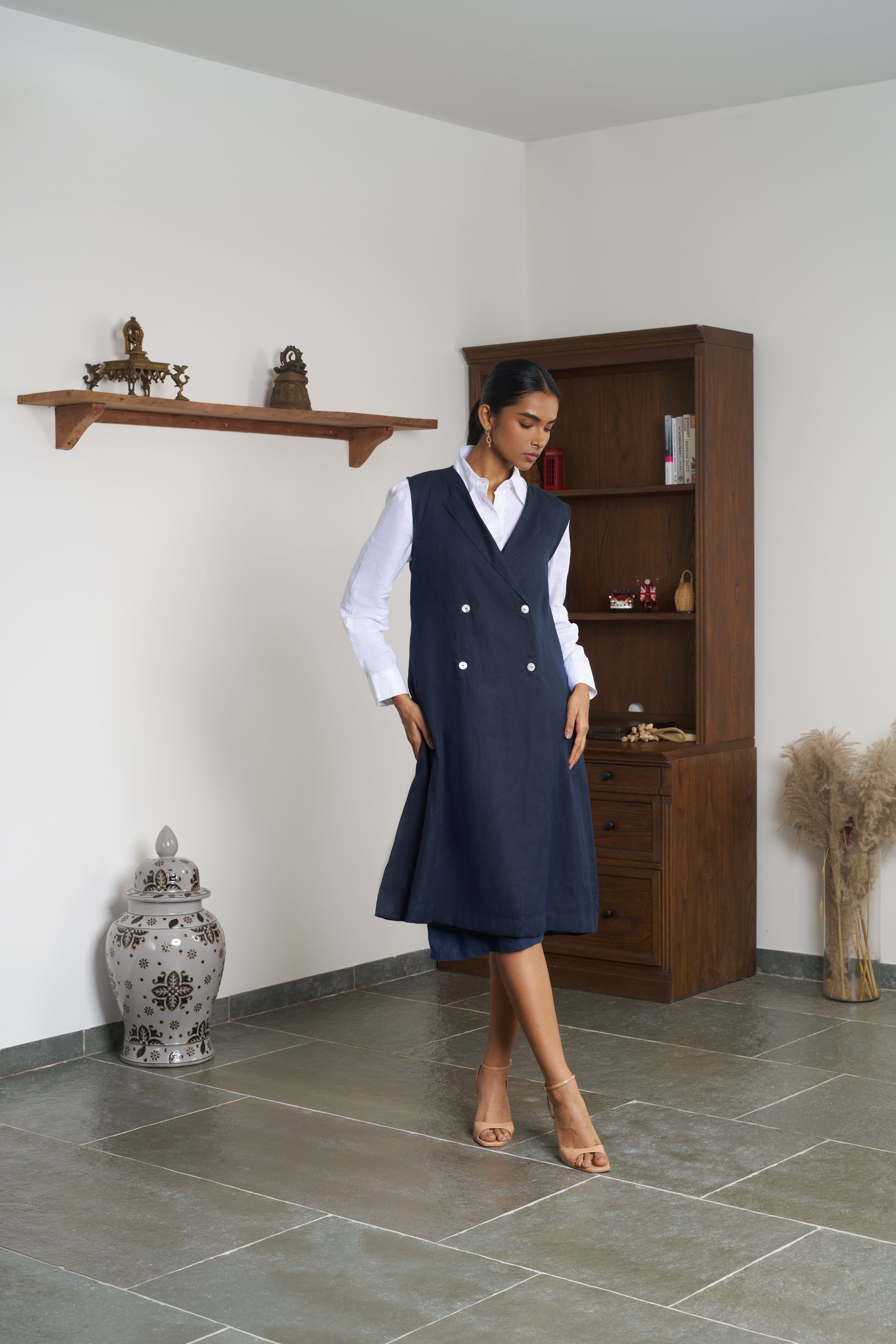 Woman in a white shirt and navy outfit. ethical clothing brands for women, slow fashion India