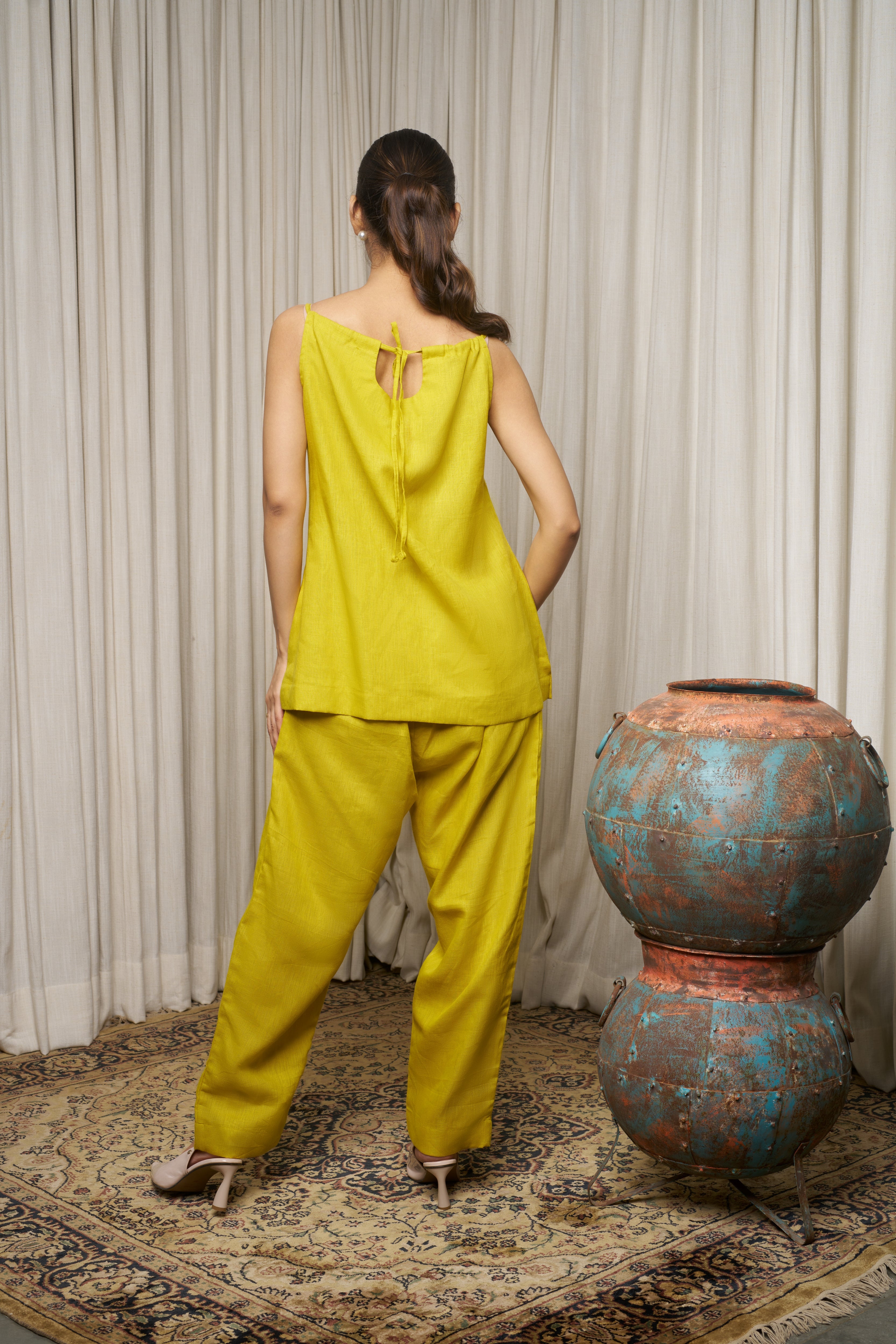 Woman in a yellow outfit. ethical clothing brands for women, Casual linen fashion
