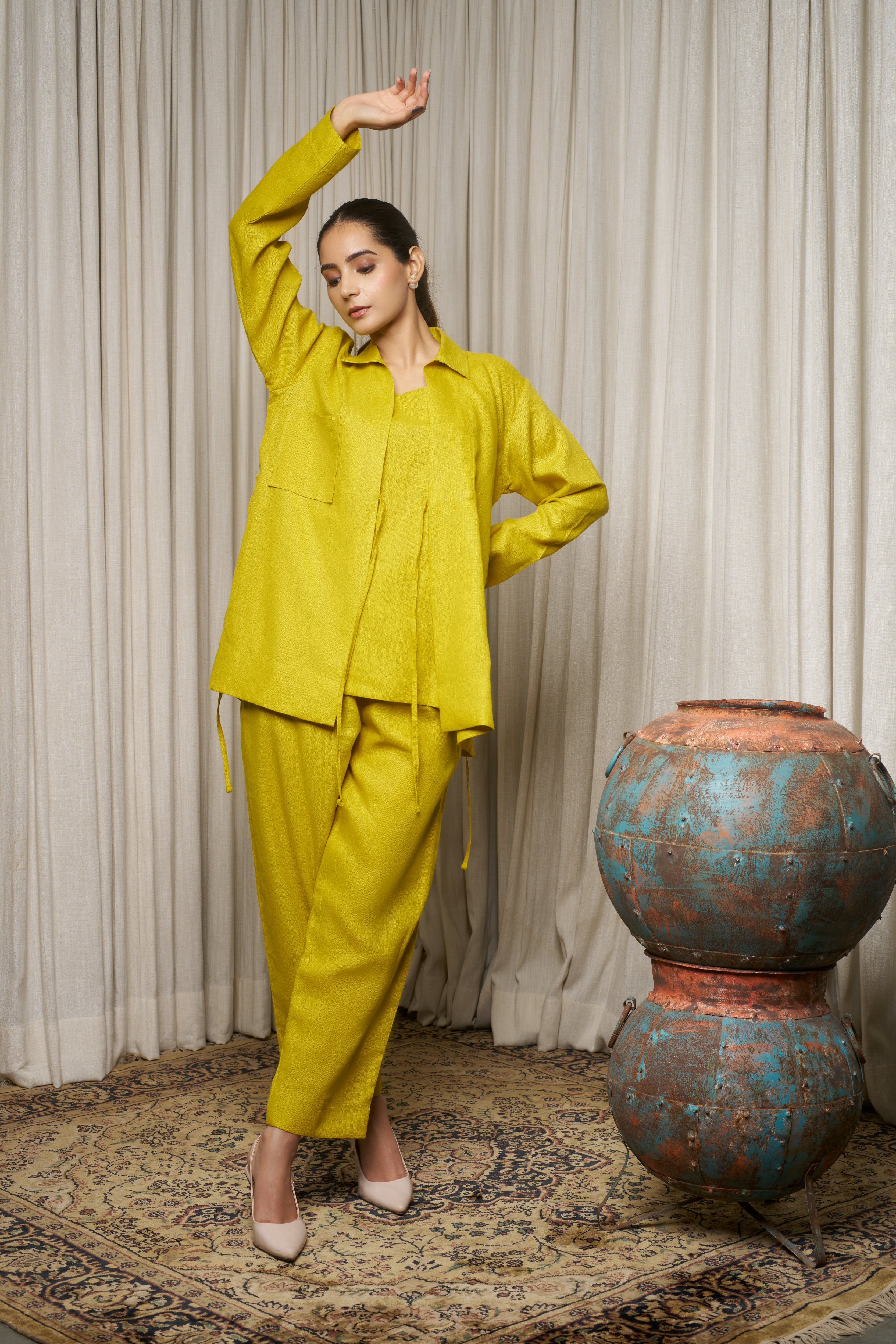 Woman in a bright yellow outfit. azo-free dyed clothes India, sustainable fashion brands India