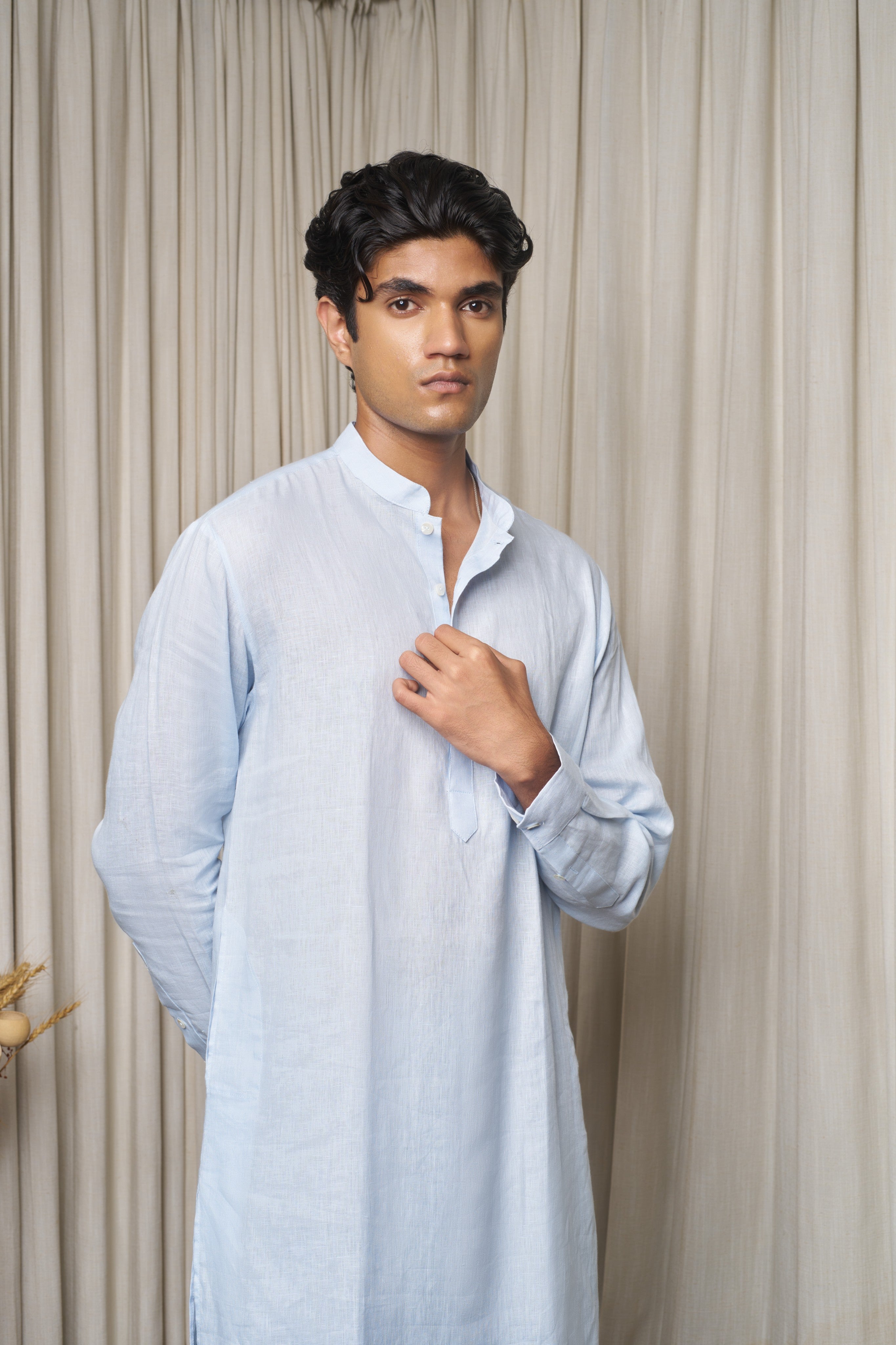 Man wearing a white traditional outfit ethical men’s fashion India, slow fashion menswear
