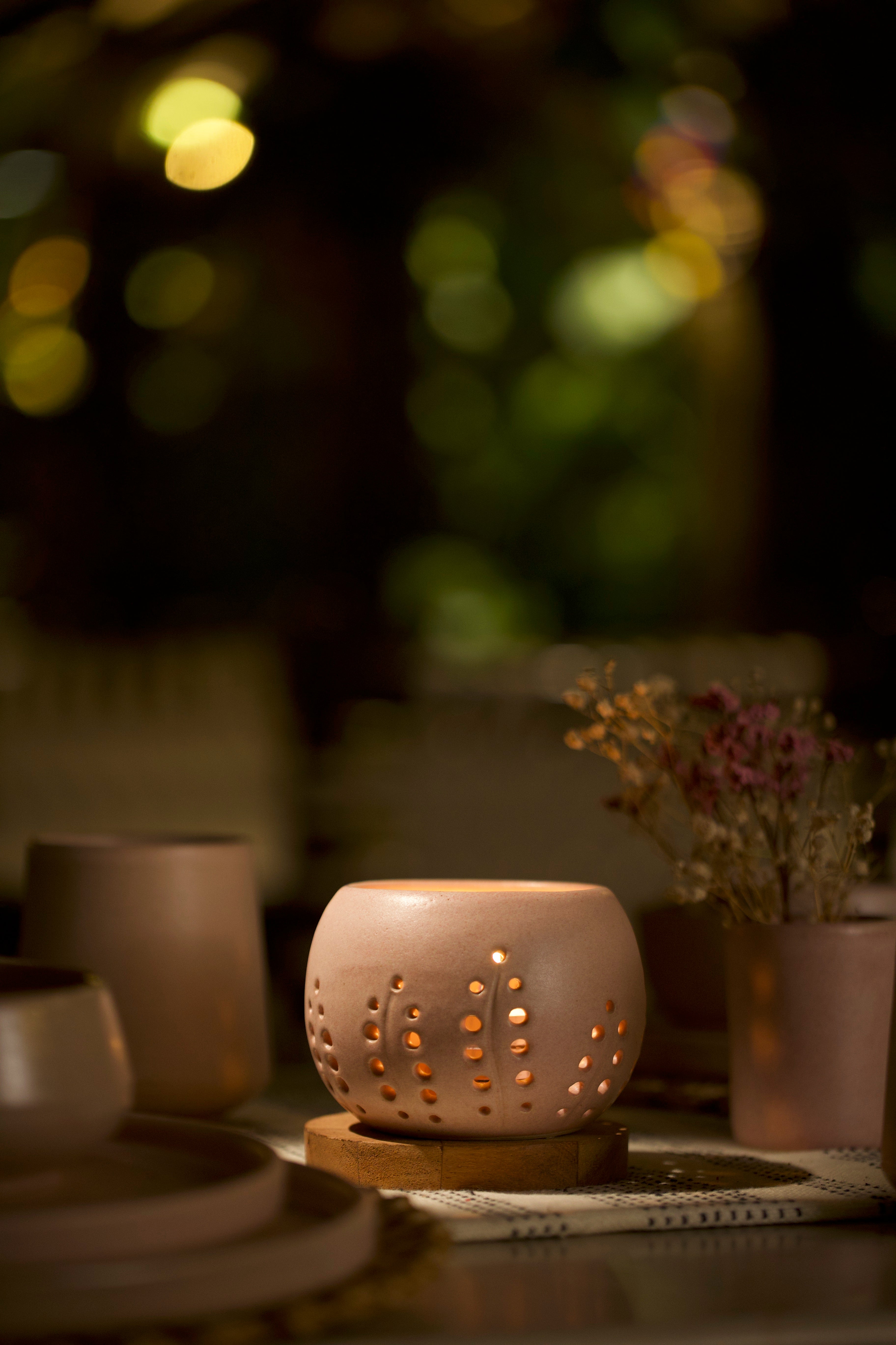A pink decorative ceramic pot with intricate design. Home decor shop online, artisanal home décor India
