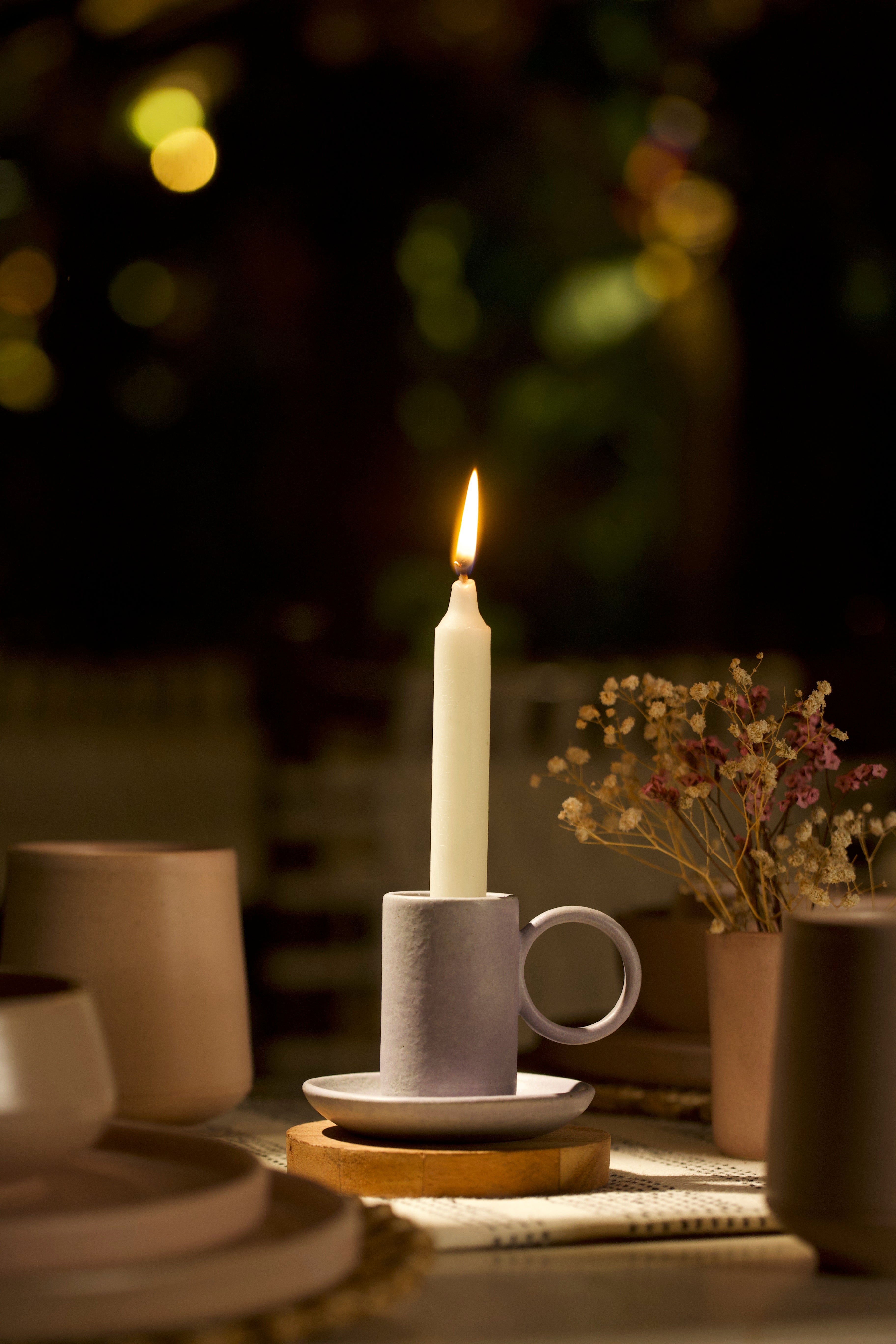 A white holder on a table. handmade ceramics India, ceramic home décor online