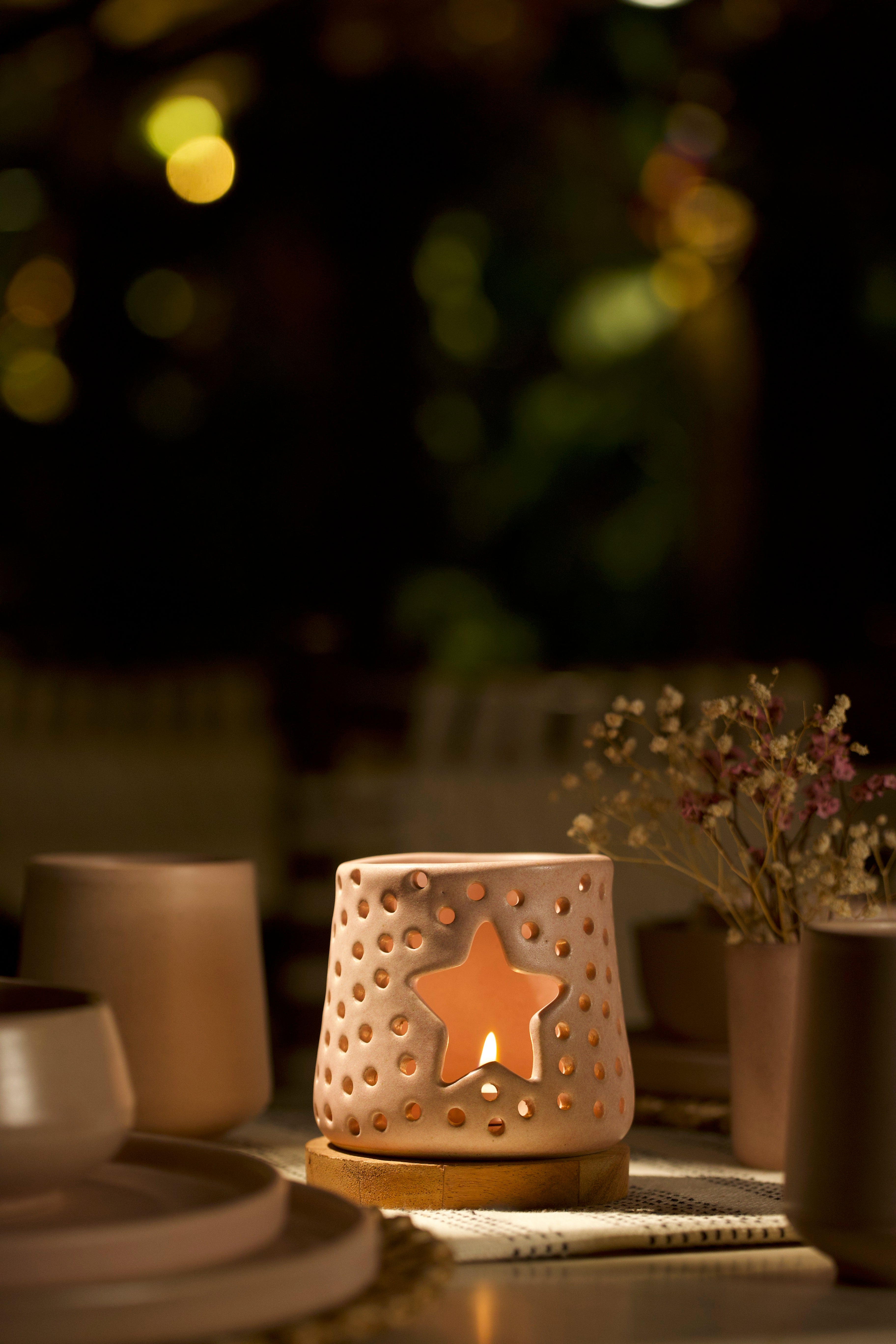 A pink decorative ceramic lantern with intricate design. ceramic home décor online, minimalist home décor India
