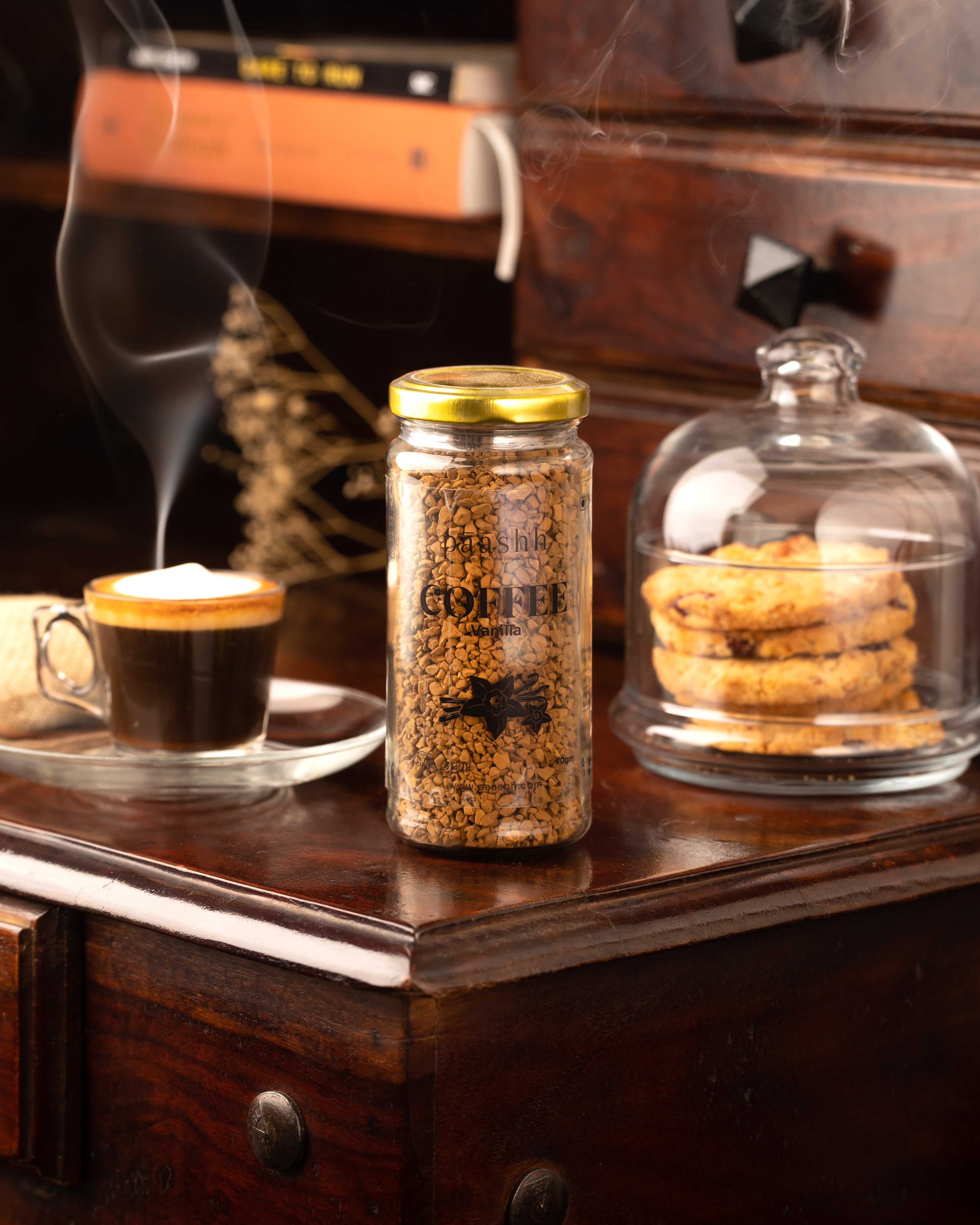Jar of coffee, cup of coffee, and cookies on a wooden surface, artisanal coffee beans India, farm-to-jar products India
