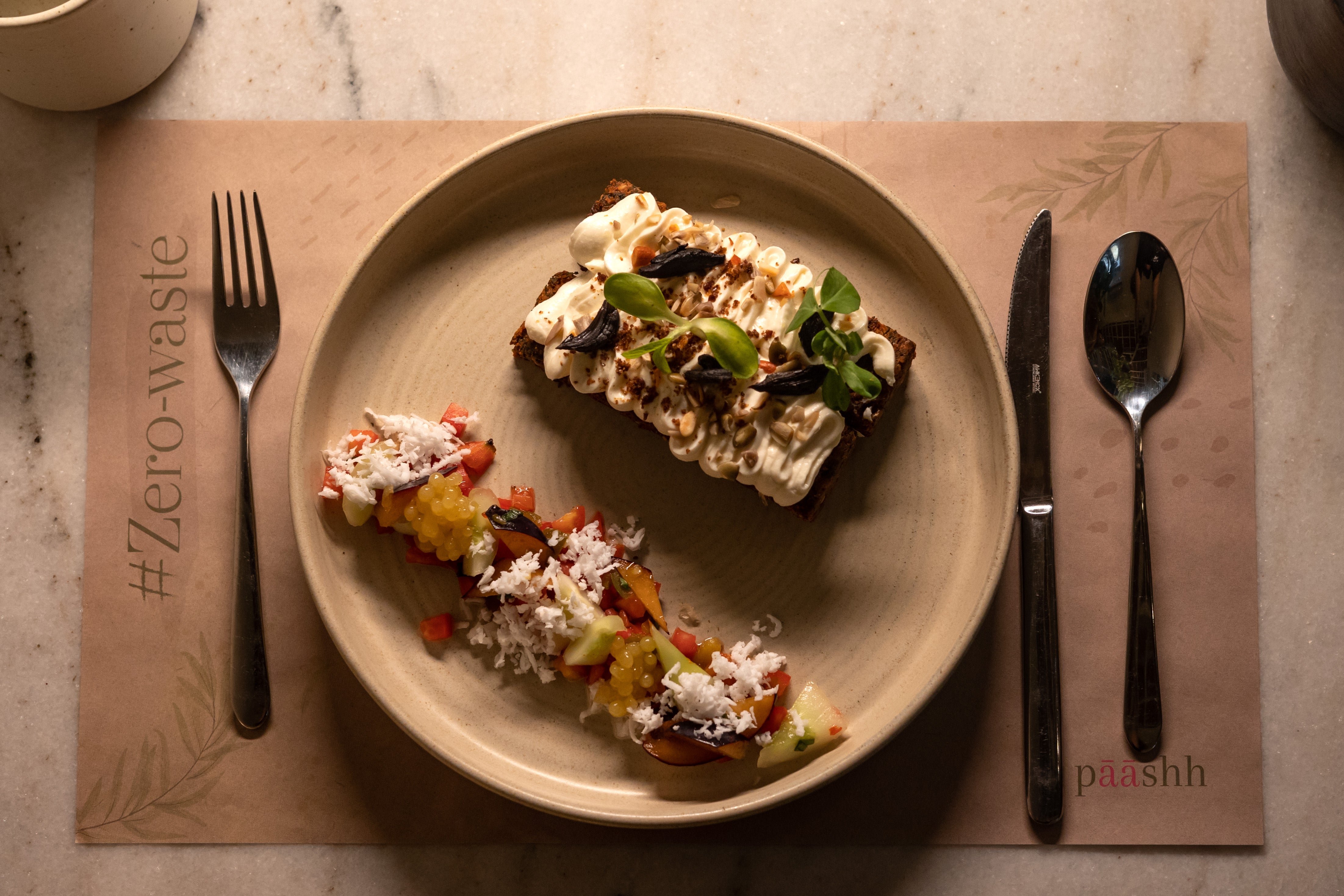 Plated food on a plate with cutlery,  vegan cafés in Mumbai, sustainable cafés in Bandra, garden cafés in Pune