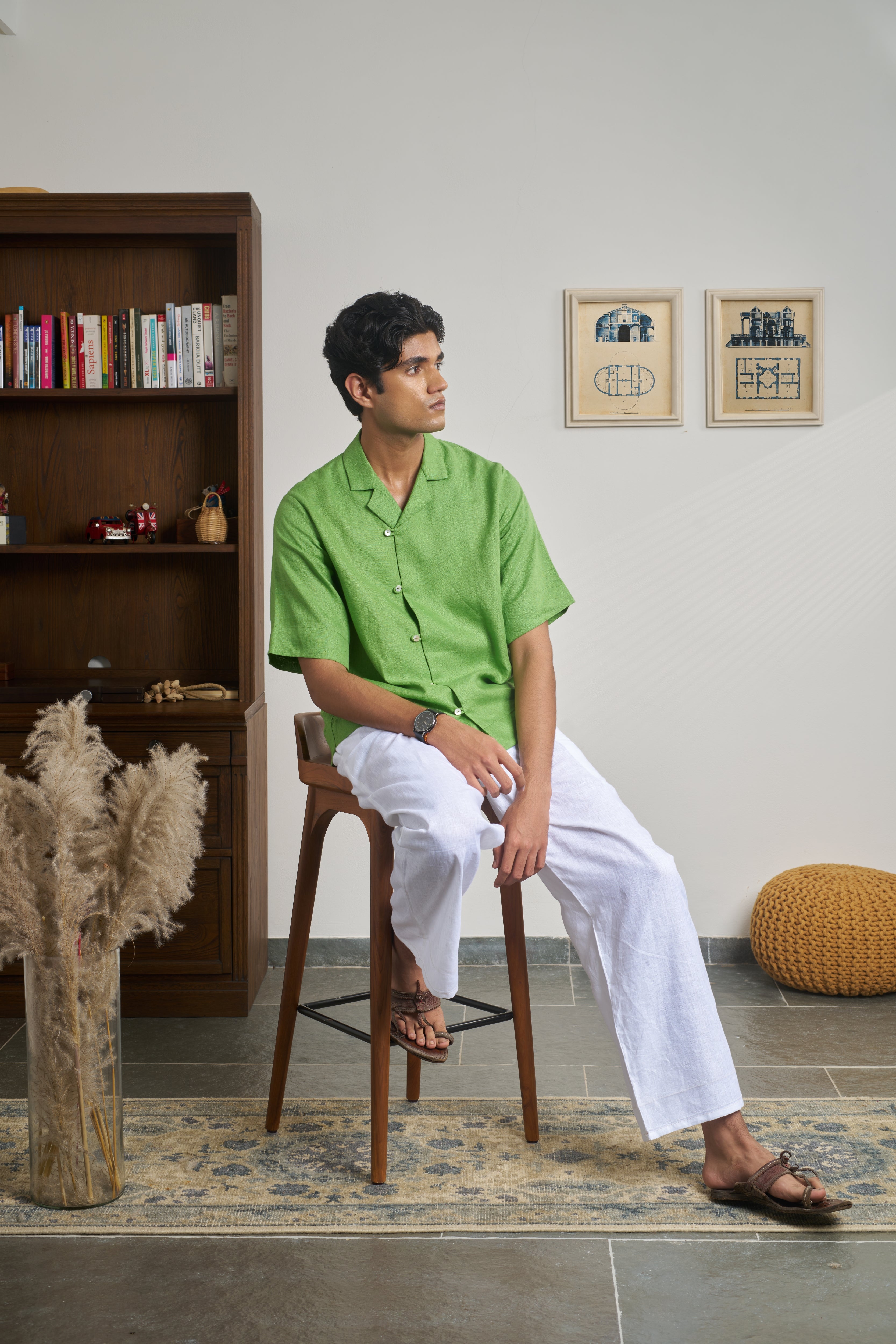 Man wearing a green shirt with short sleeves men’s resort wear India, 
breathable linen shirts India