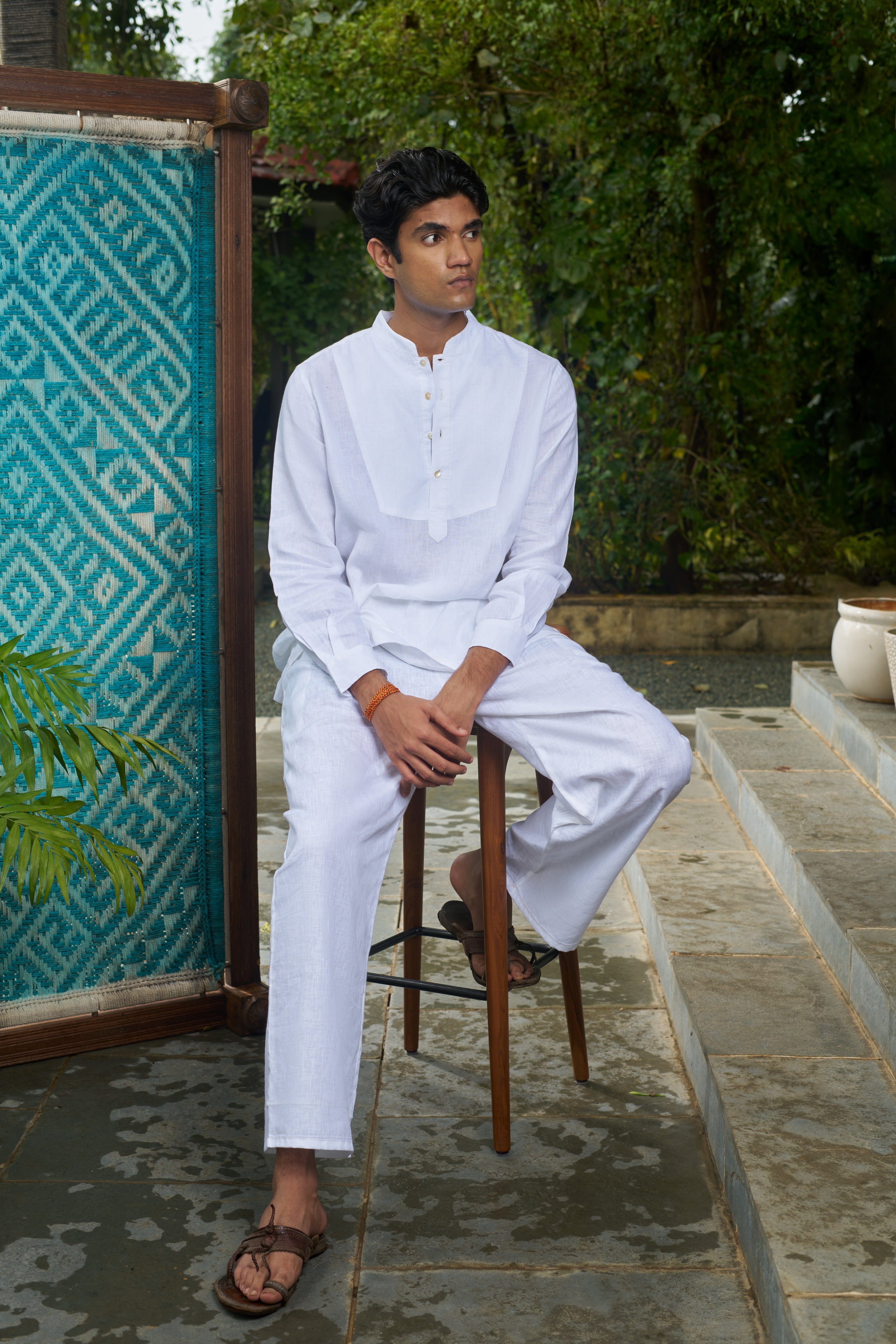 Man wearing a white traditional outfit, ethical men’s fashion India, minimal menswear brands India