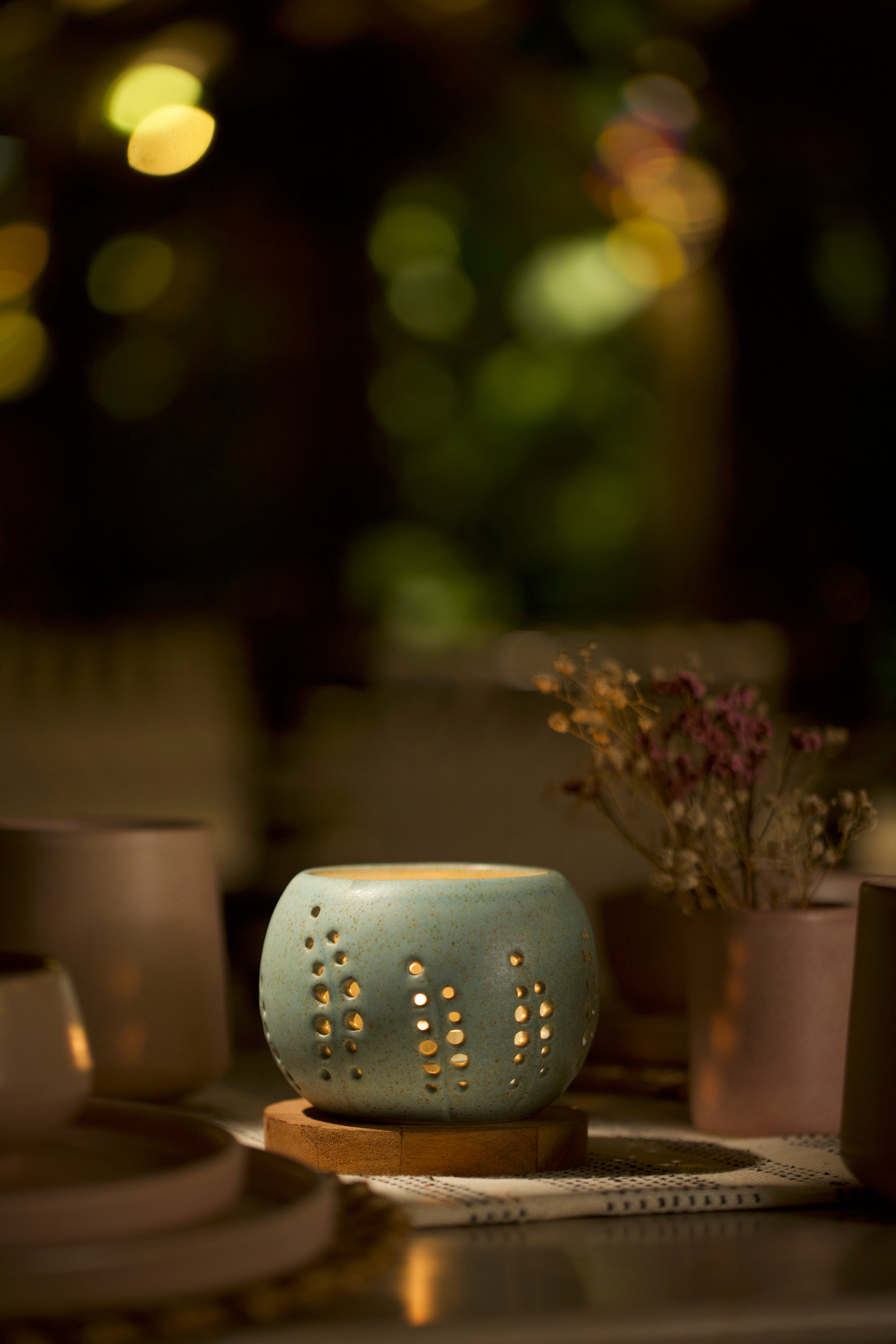 A mint decorative ceramic pot with intricate design. Home decor shop online, artisanal home décor India