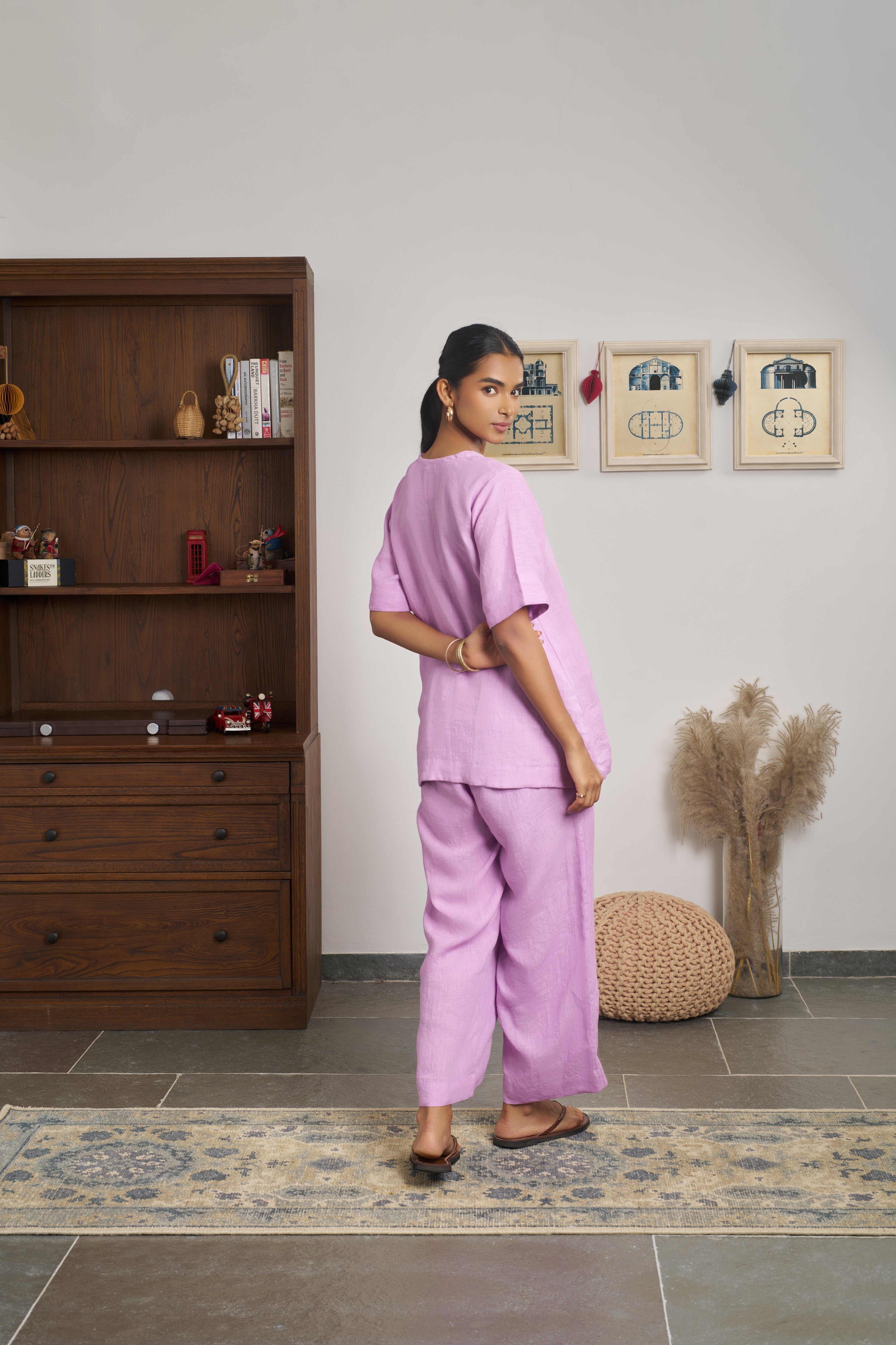 Woman in a pink outfit. women’s linen clothing India,  minimalist clothing brands India
