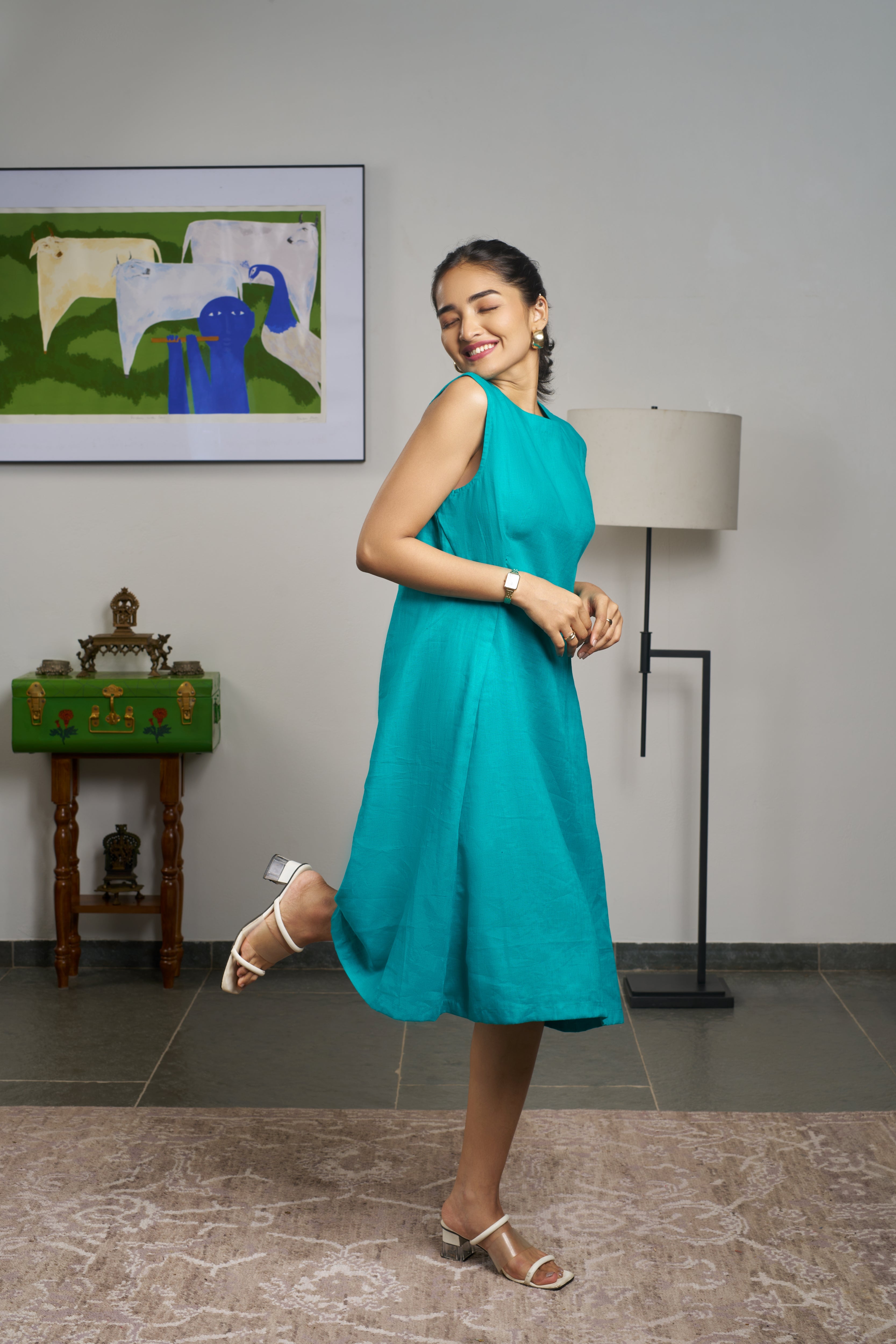 Woman in a teal blue dress. linen dresses for women India, comfortable linen dresses India

