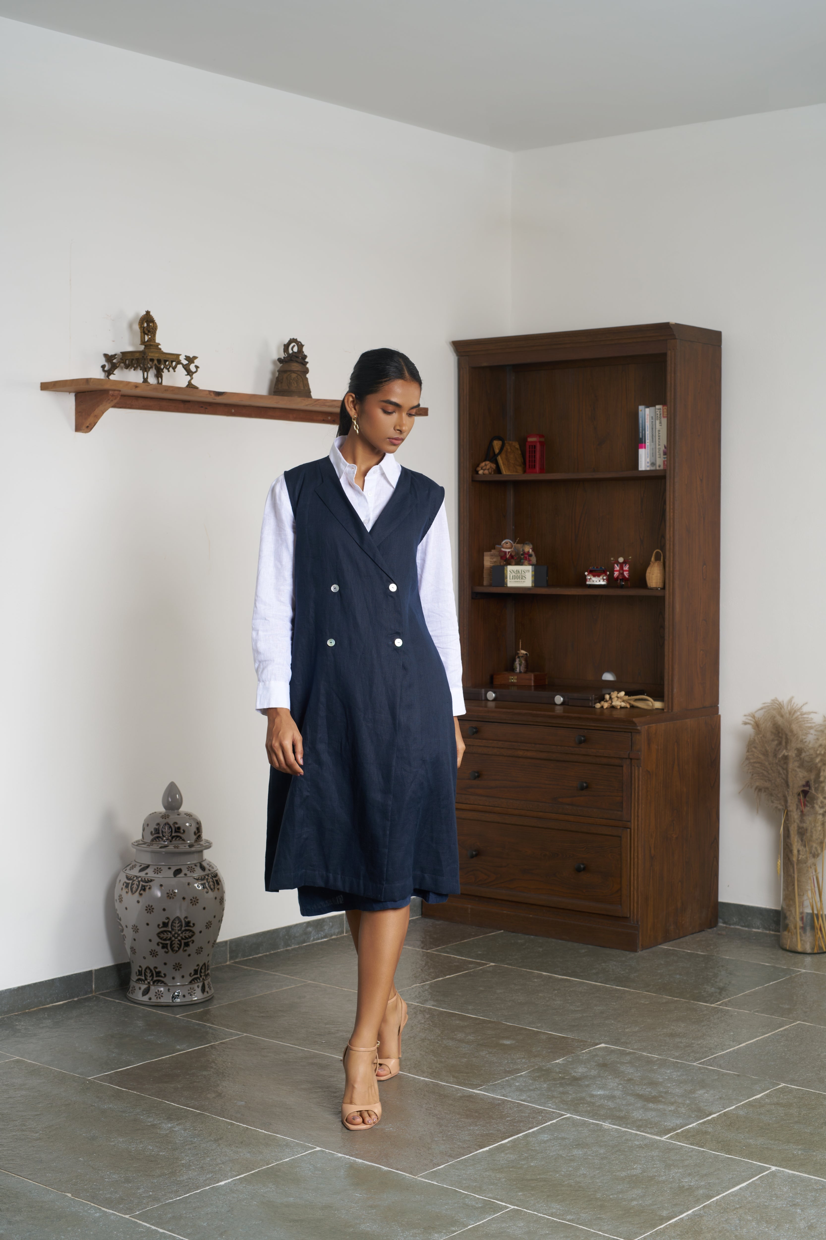 Woman in a white shirt and navy outfit. ethical clothing brands for women, slow fashion India
