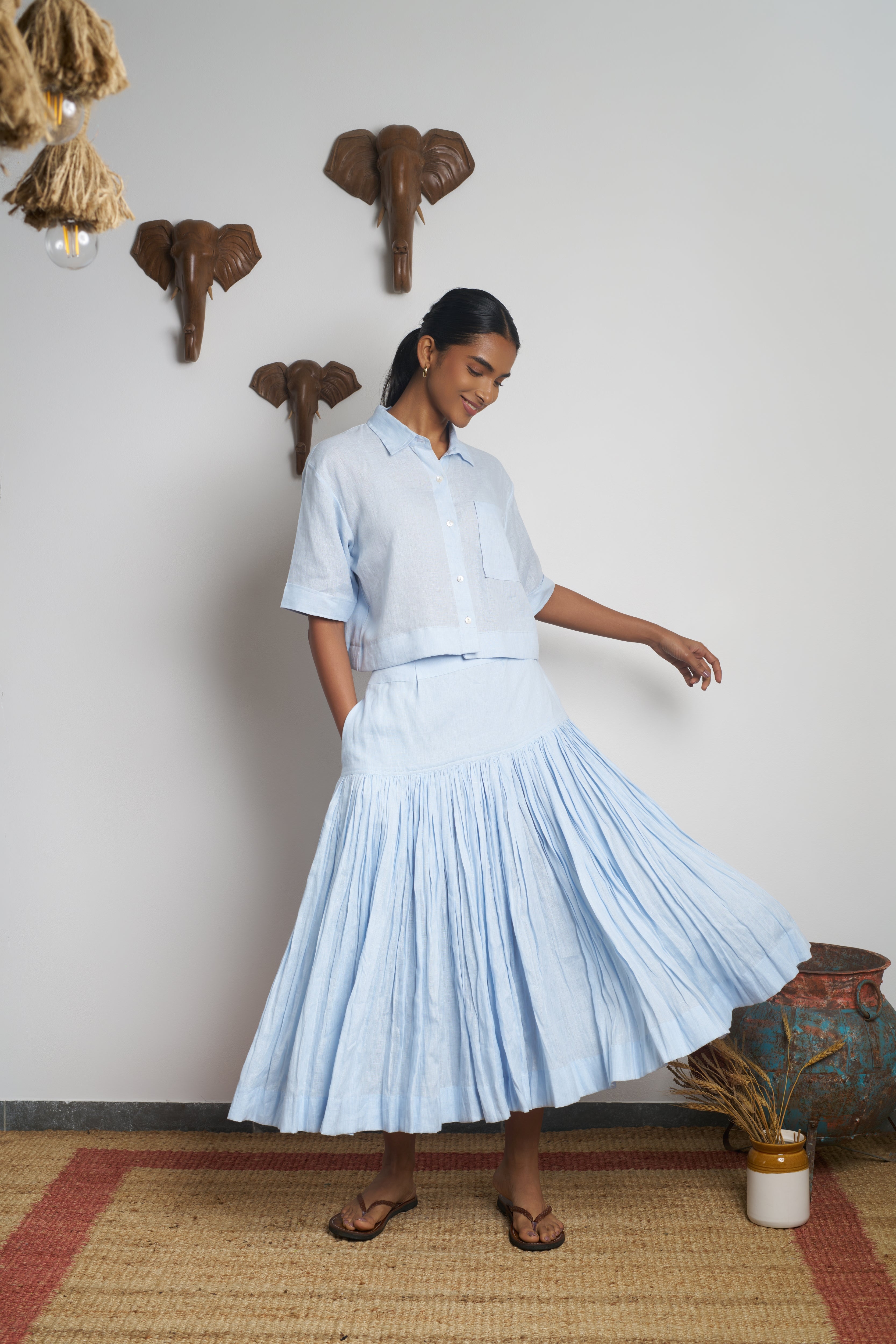 Woman in a light blue outfit.  women’s linen clothing India, 100% linen clothes India
