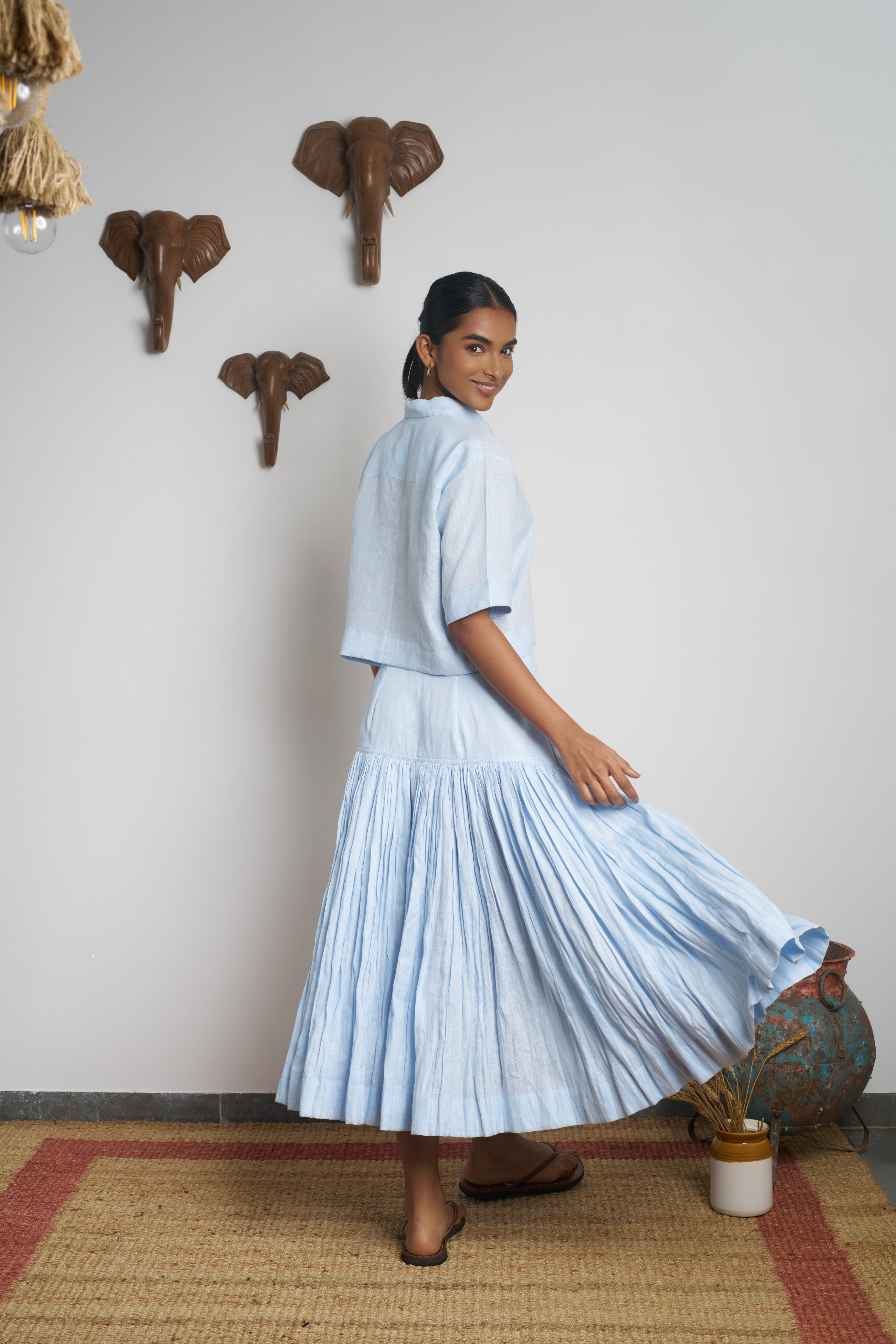 Woman in a light blue outfit.  women’s linen clothing India, 100% linen clothes India
