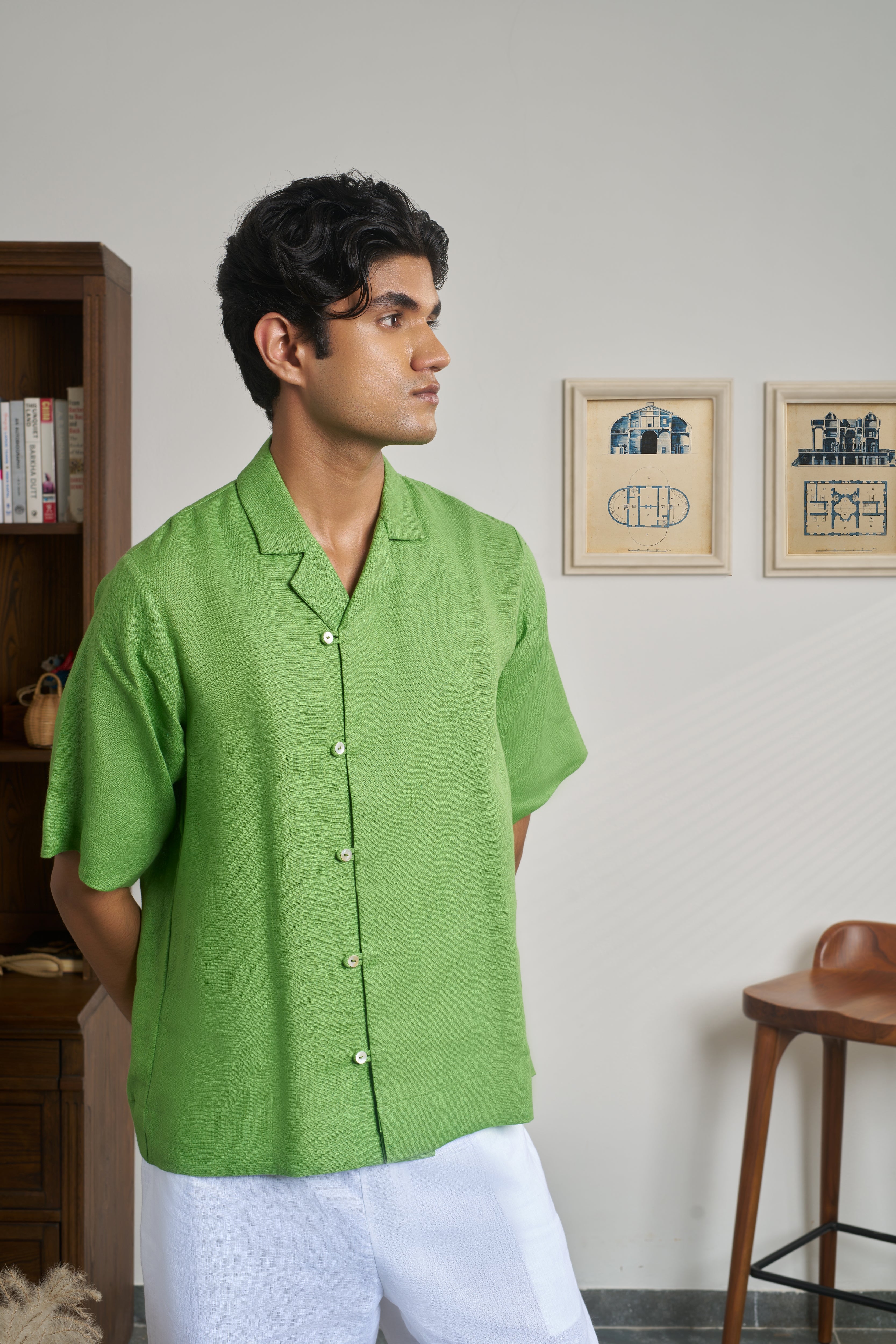 Man wearing a green shirt with short sleeves.men’s resort wear India, 
breathable linen shirts India