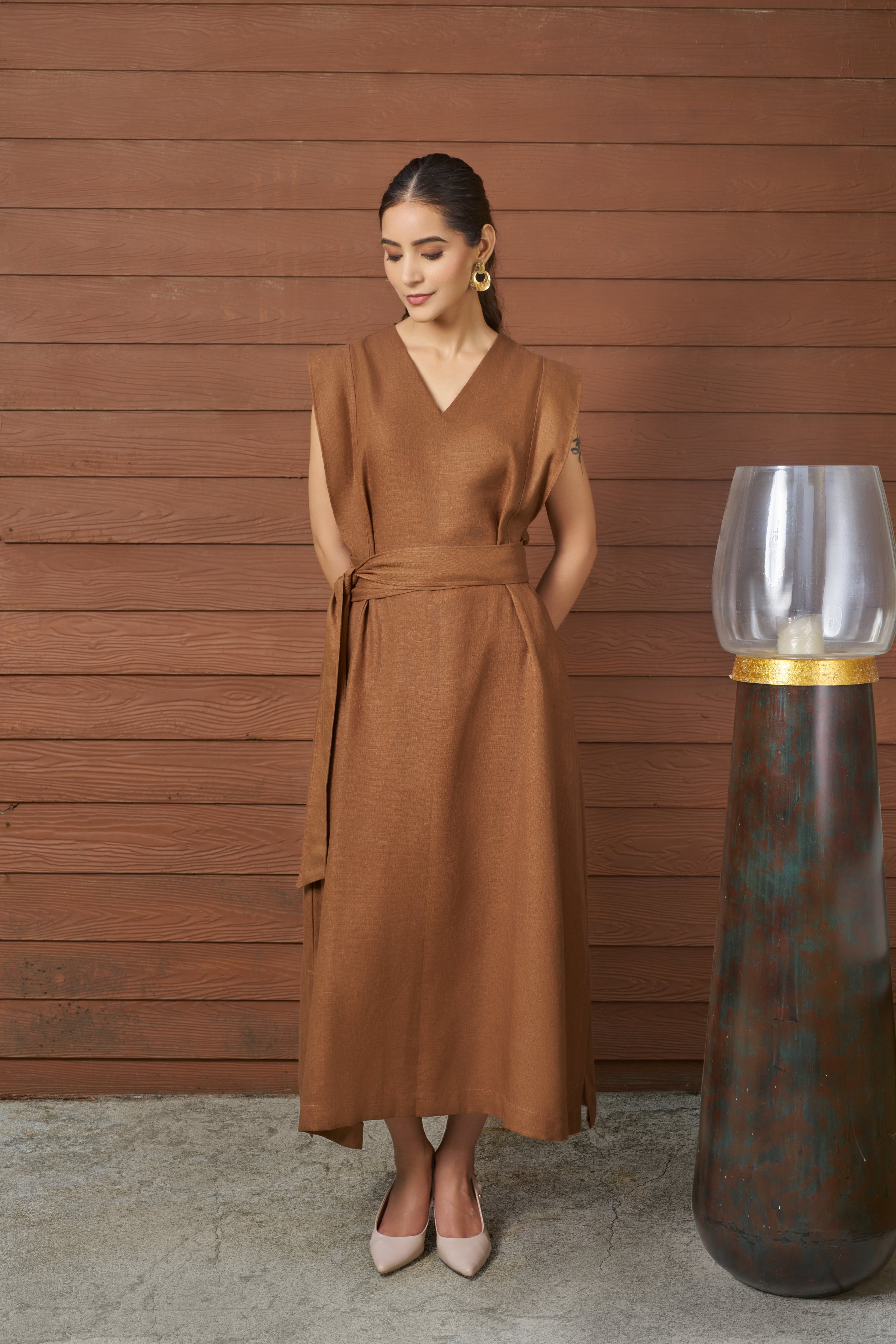 Woman wearing a brown dress.