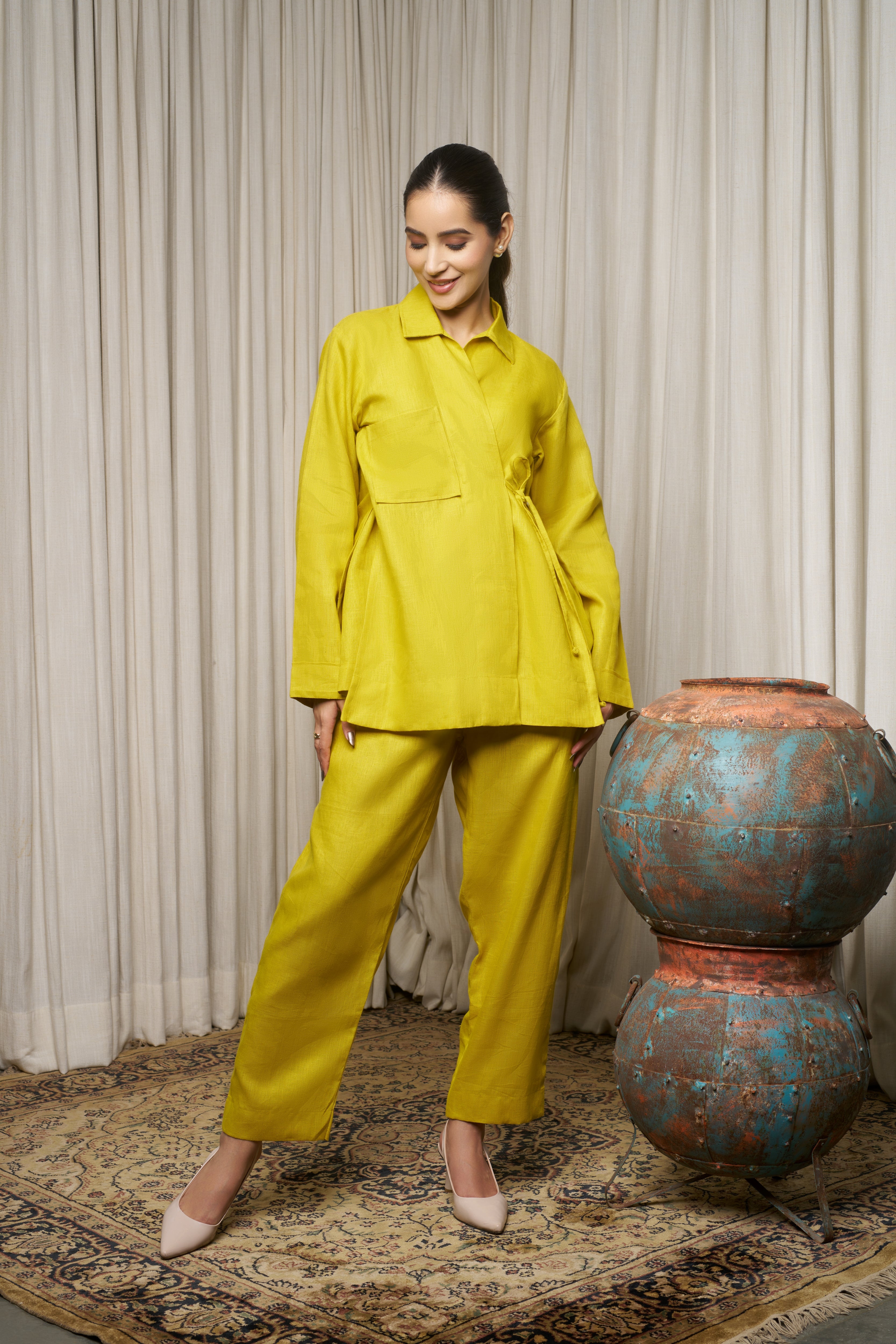 Woman in a bright yellow outfit.azo-free dyed clothes India, sustainable fashion brands India