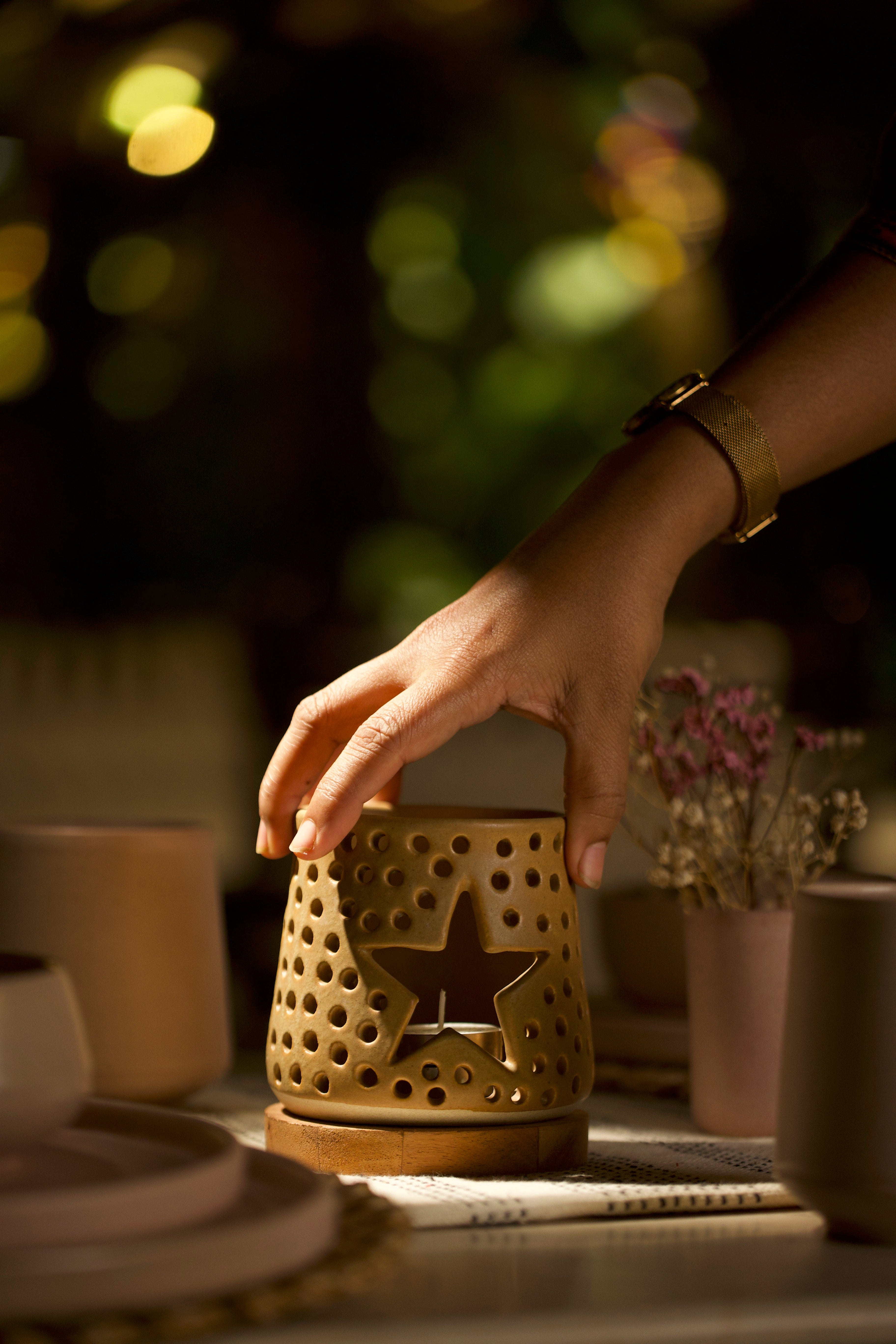 A mustard decorative ceramic lantern with intricate design.  ceramic home décor online, minimalist home décor India
