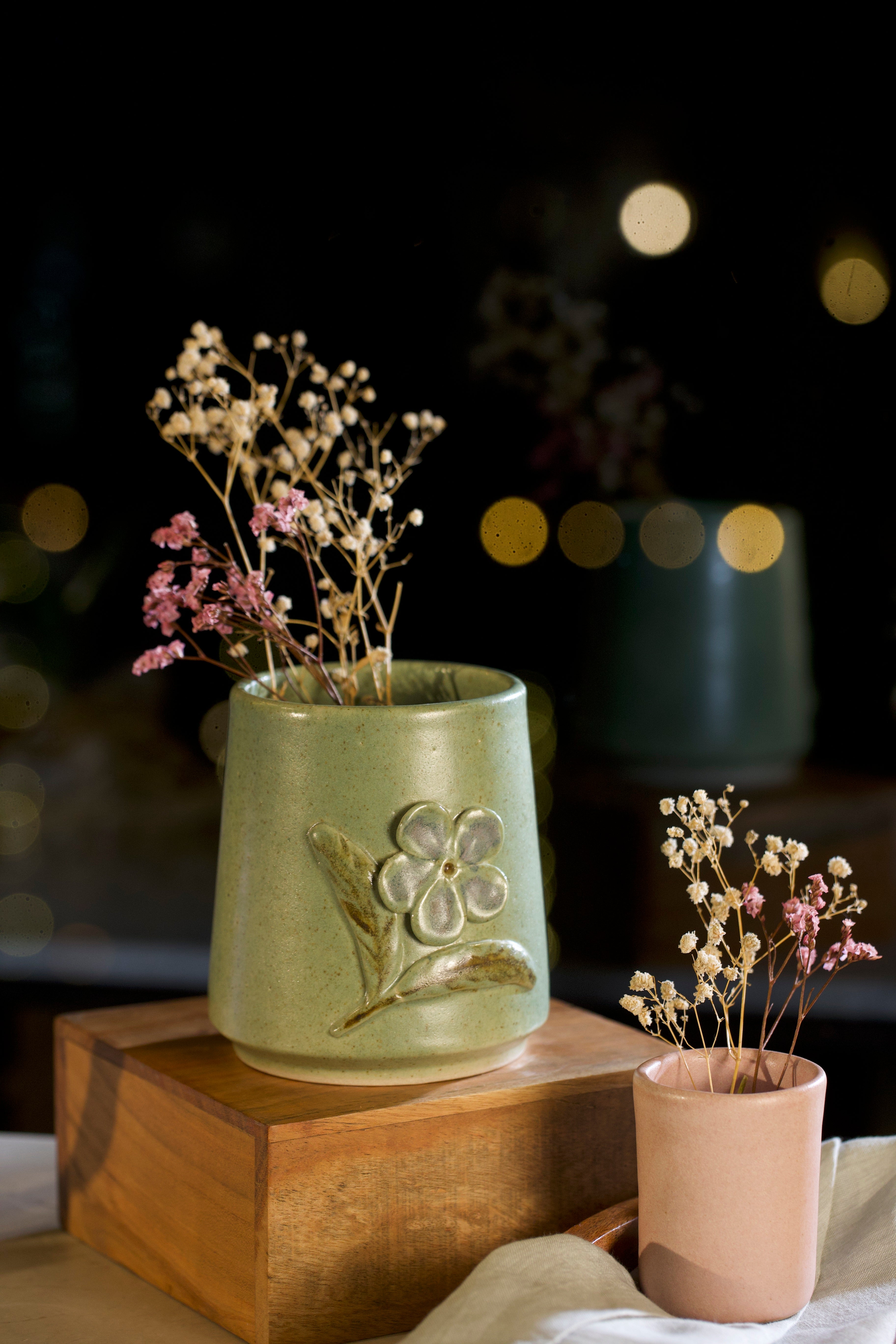 A green ceramic vases with dried flowers,  pottery home decor,  
handmade clay planters