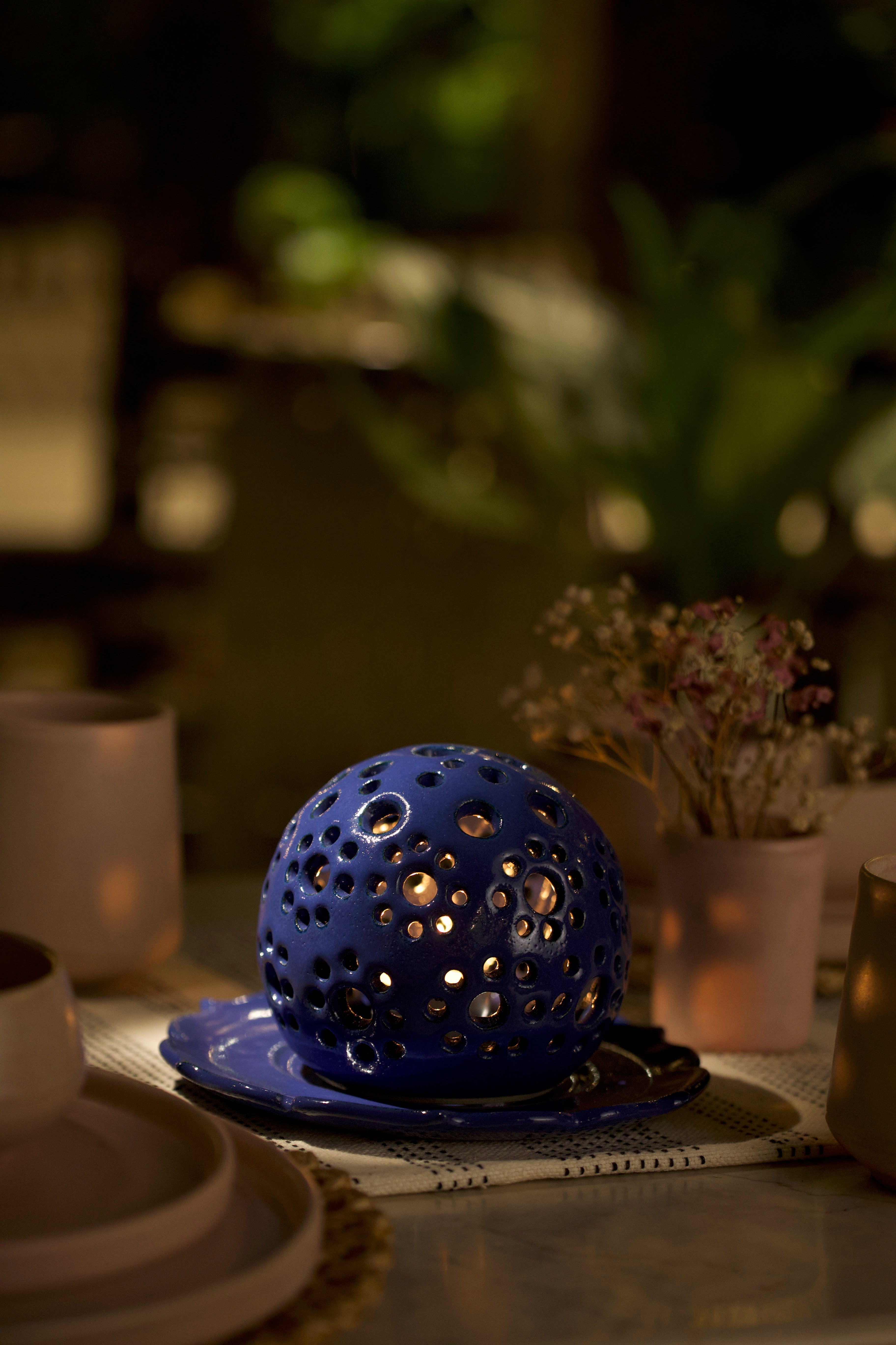 A blue decorative ceramic pot with intricate design. minimalist home décor India, handmade ceramics India
