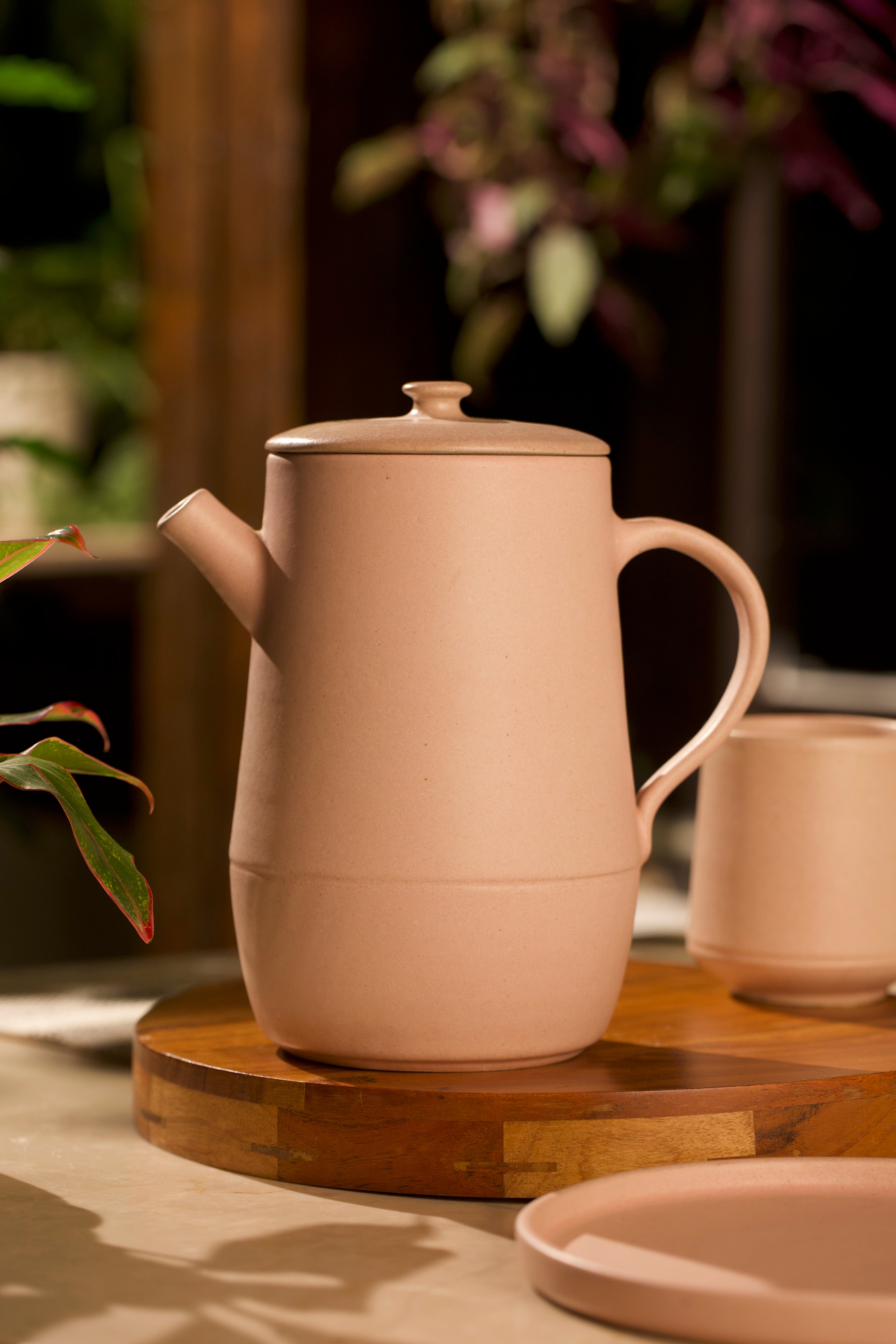 Ceramic teapot and cup on a wooden tray, ceramic tableware India, pottery brands in India